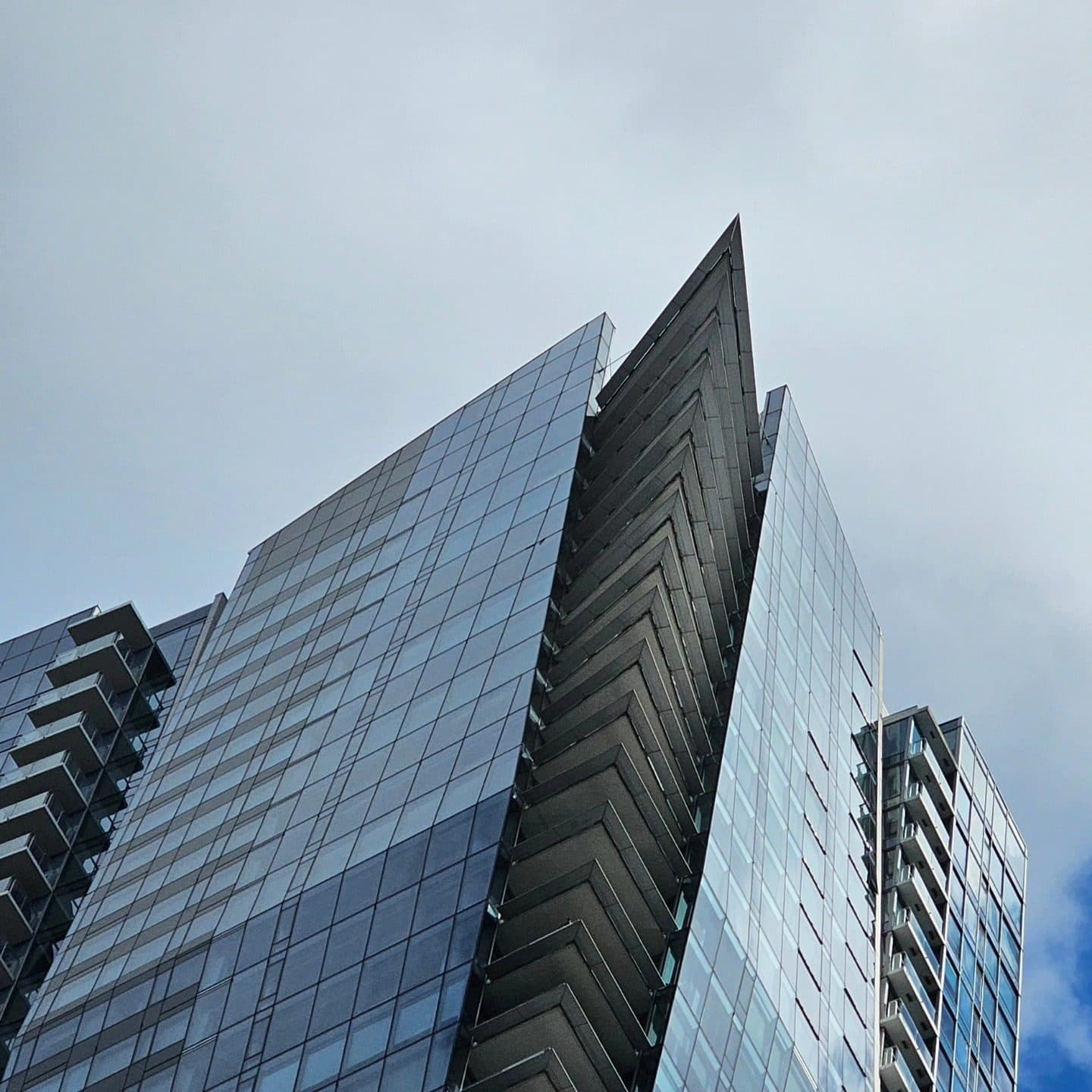 Looking up at glass high-rise towers