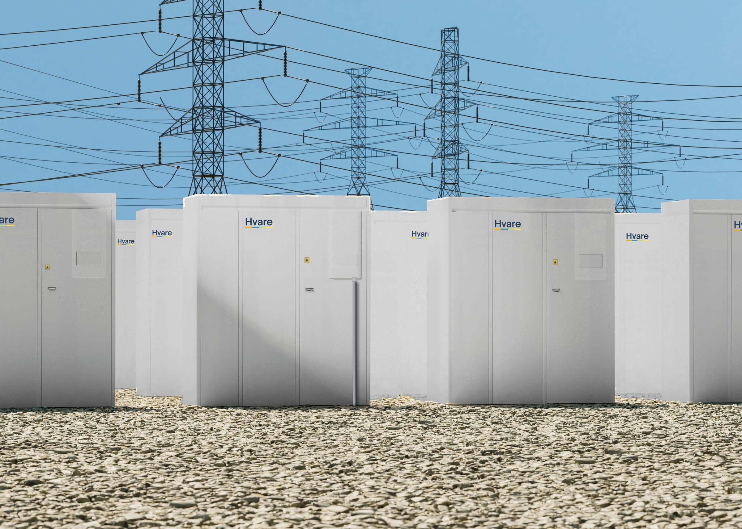 A row of Hvare-branded battery energy storage units beneath transmission towers
